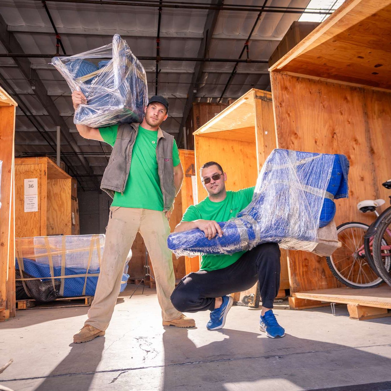 Finch crew carrying wrapped contents